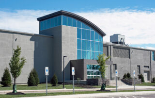 Tinted Glass Building Entrance - exterior painting red flag