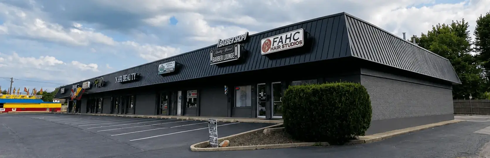 Dark gray commercial strip mall exterior repainted in Crest Hill, Illinois
