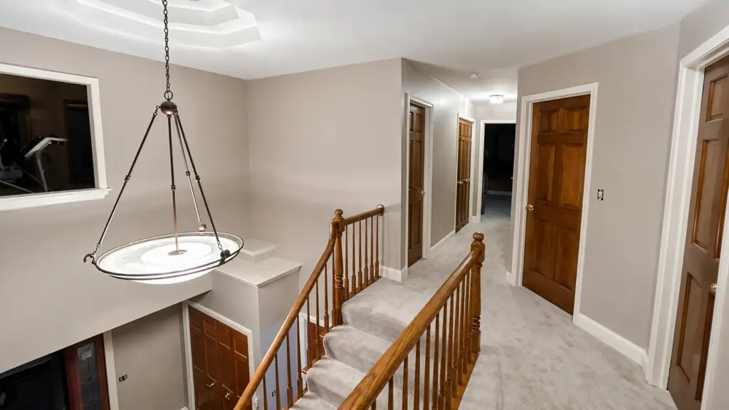 Repainted two-story foyer and upstairs hallway in an Oswego home